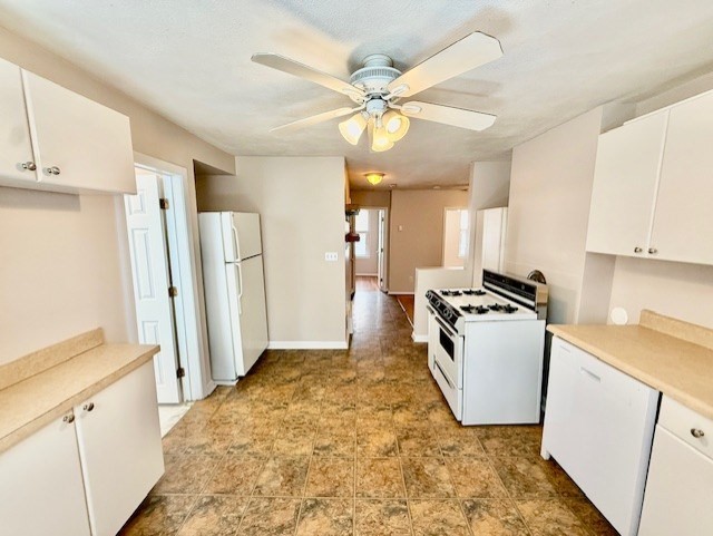 a view of a kitchen with refrigerator and a sink