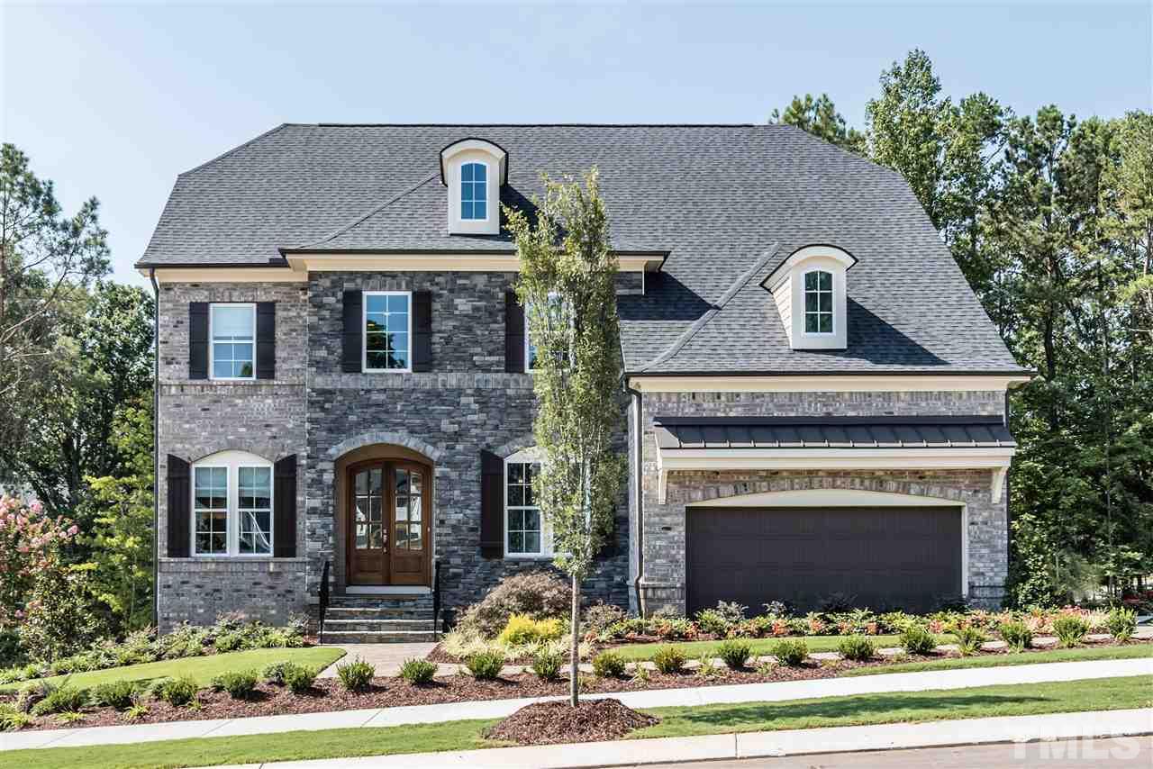 5285 Aleppo Lane Raleigh, NC 27613 - Photo 1 of 25 a front view of a house with a garden