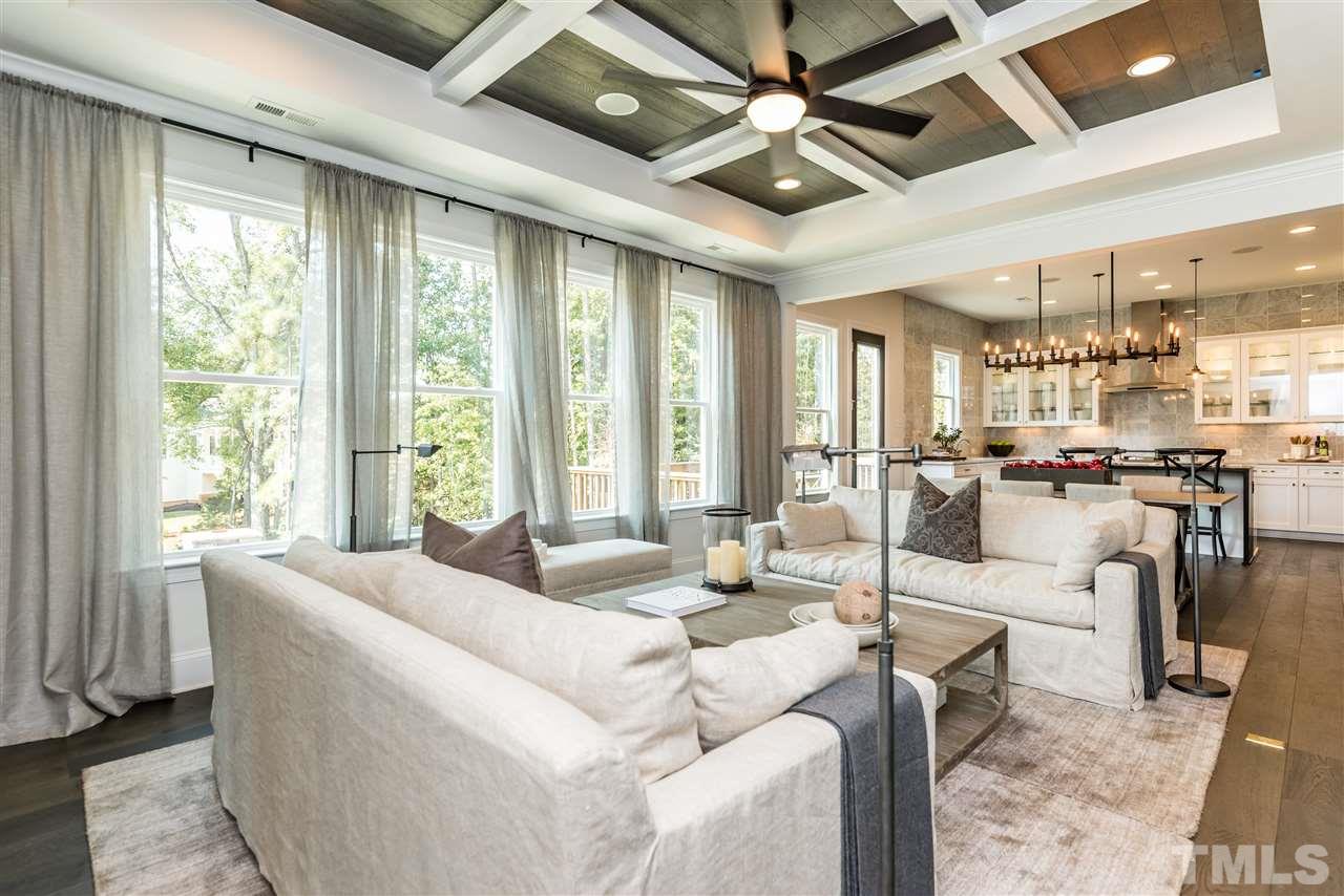 5285 Aleppo Lane Raleigh, NC 27613 - Photo 2 of 25 a living room with fireplace furniture and a large window