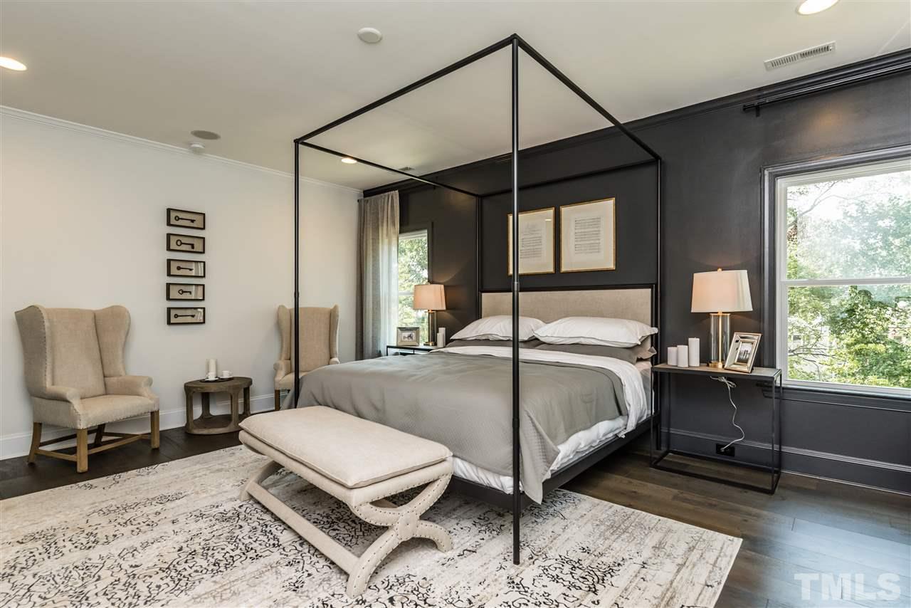 5285 Aleppo Lane Raleigh, NC 27613 - Photo 17 of 25 a bedroom with a bed a chair and a large window
