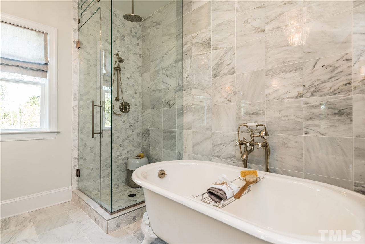 5285 Aleppo Lane Raleigh, NC 27613 - Photo 19 of 25 a bathroom with a tub and shower