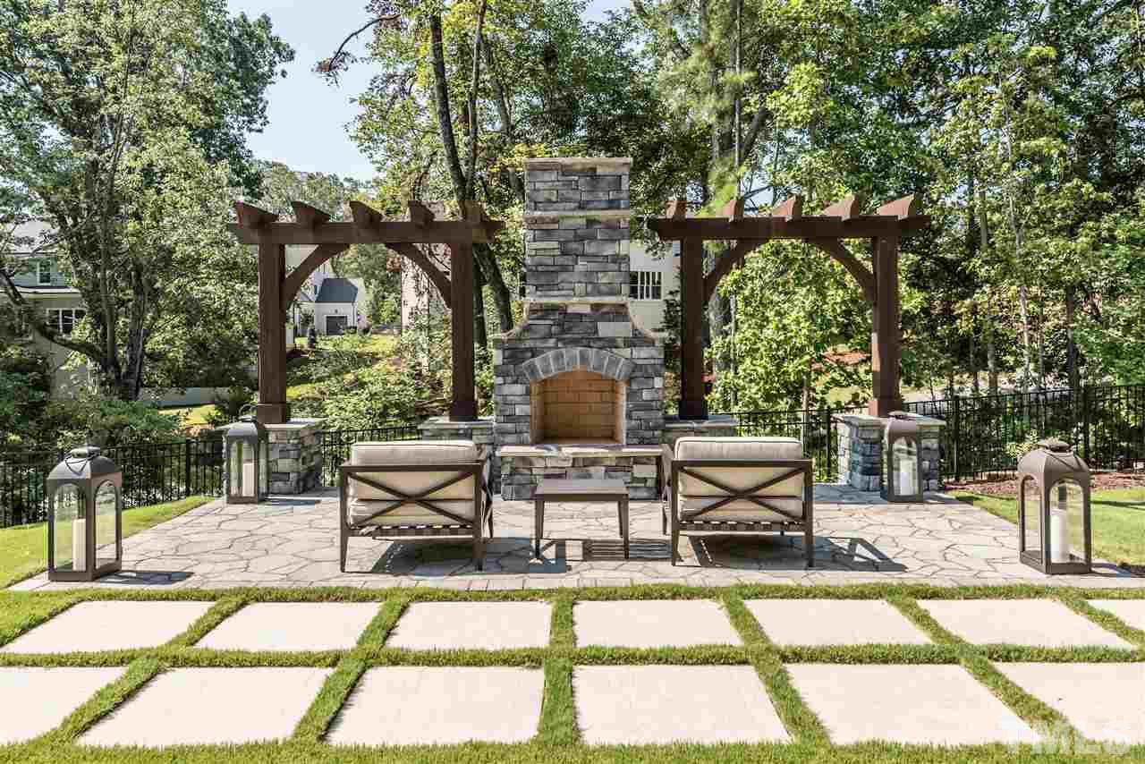 5285 Aleppo Lane Raleigh, NC 27613 - Photo 25 of 25 a view of a patio with couches table and chairs and potted plants