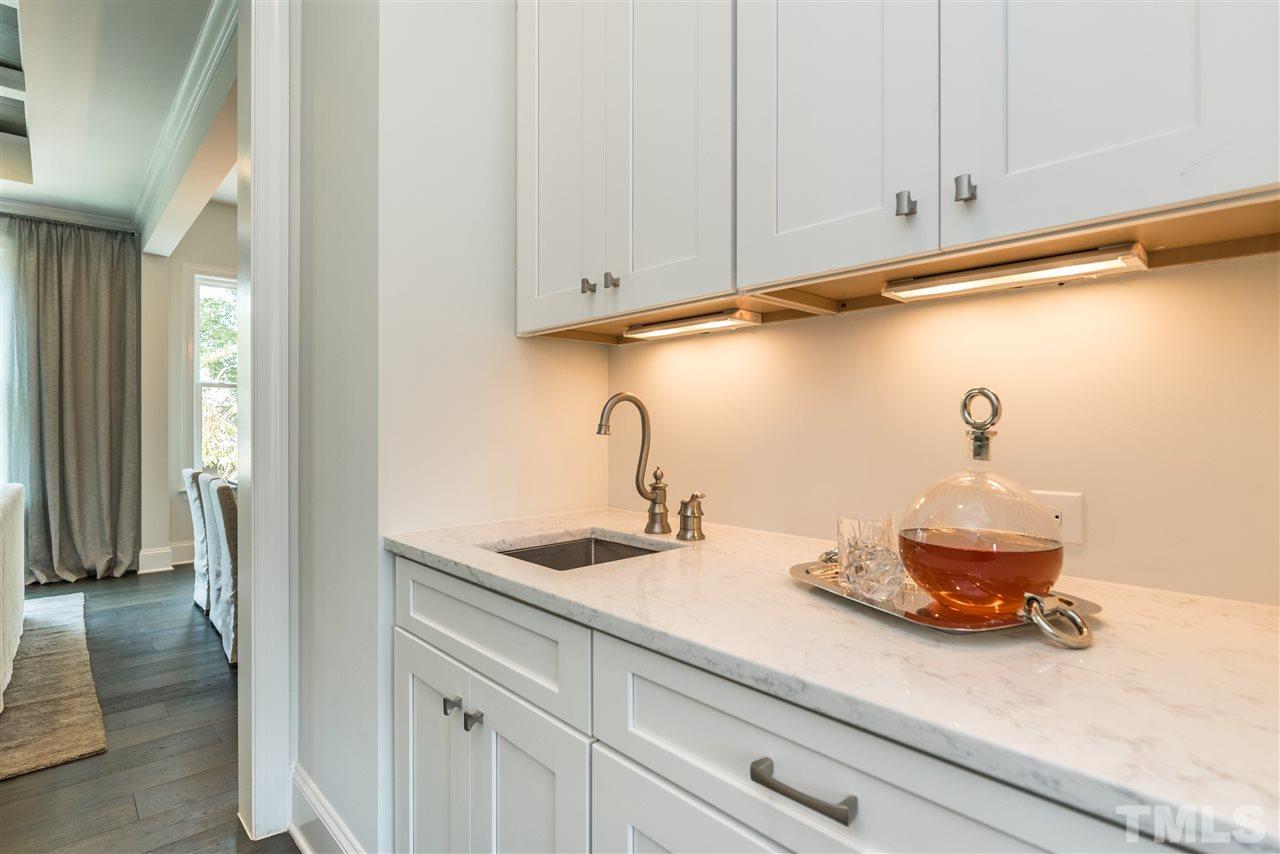 5285 Aleppo Lane Raleigh, NC 27613 - Photo 5 of 25 a bathroom with a sink and a mirror