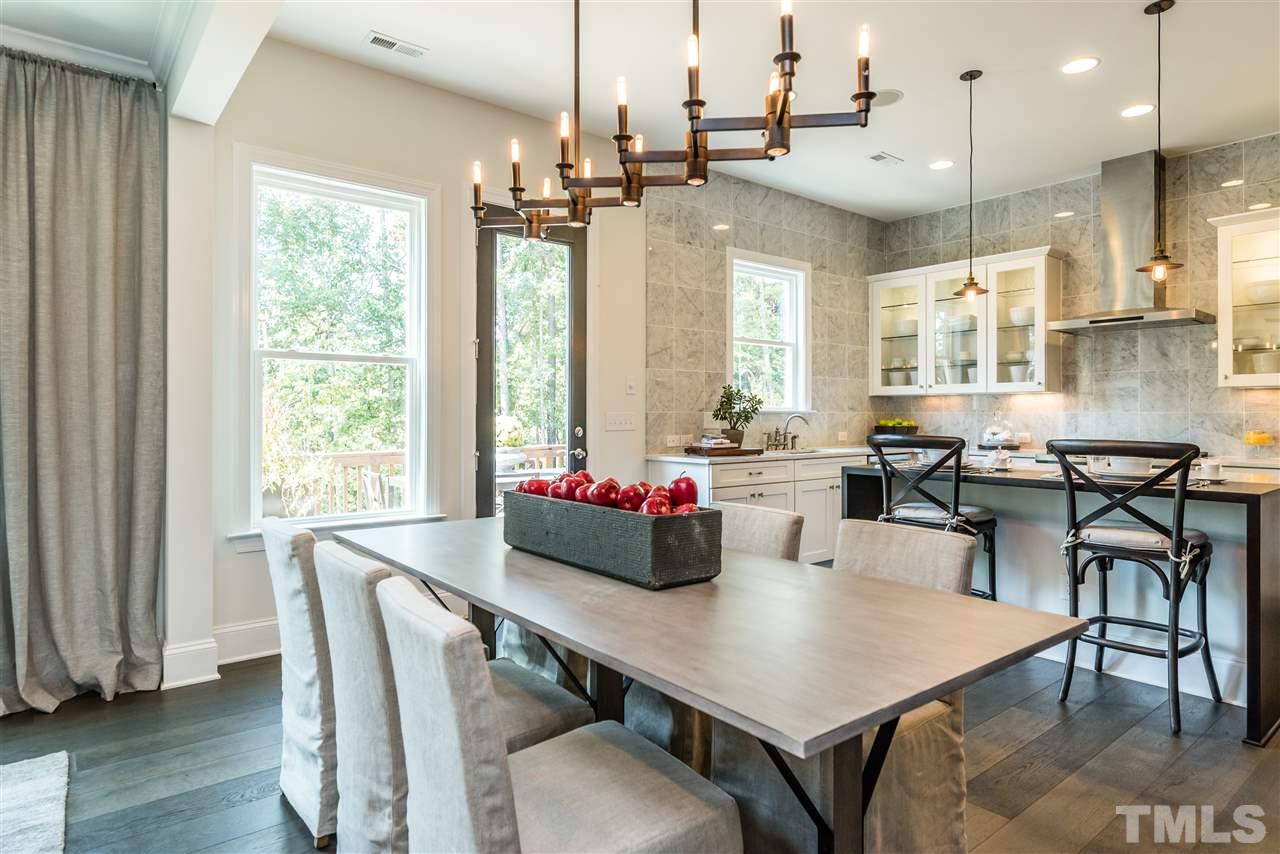 5285 Aleppo Lane Raleigh, NC 27613 - Photo 6 of 25 a view of a dining room with furniture window and wooden floor
