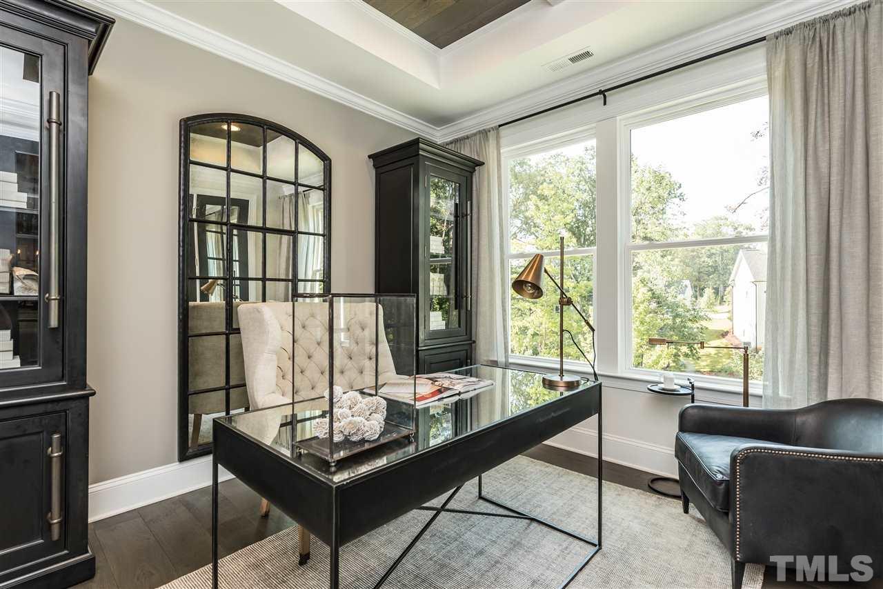 5285 Aleppo Lane Raleigh, NC 27613 - Photo 9 of 25 a living room with furniture and a floor to ceiling window