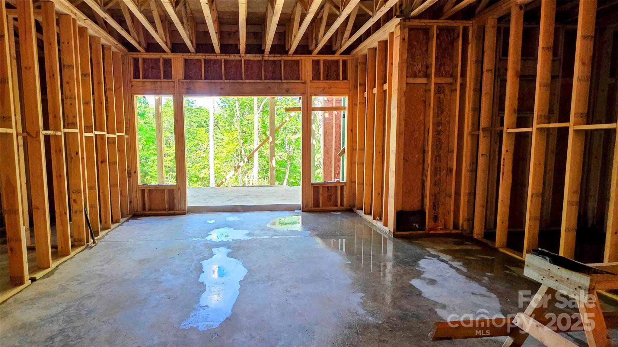 297 Easy Springs Road Sapphire, NC 28774 - Photo 19 of 34 a view of a porch with a table and chairs