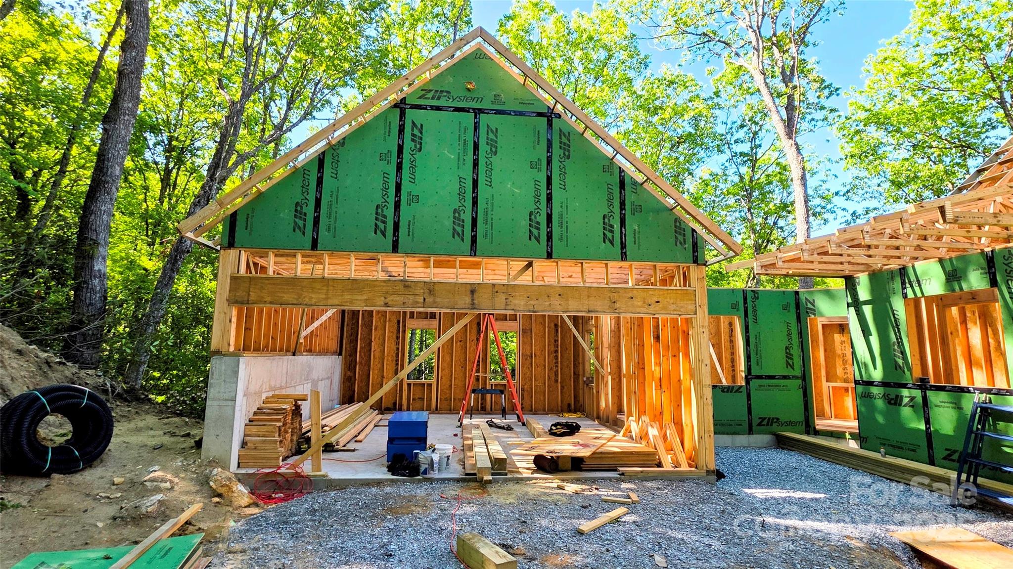 297 Easy Springs Road Sapphire, NC 28774 - Photo 8 of 34 a view of a house with backyard and a tree