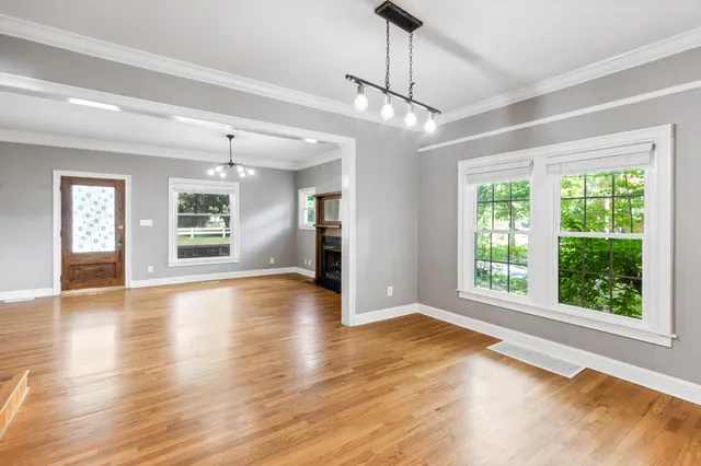 a large kitchen with stainless steel appliances granite countertop a stove and cabinets