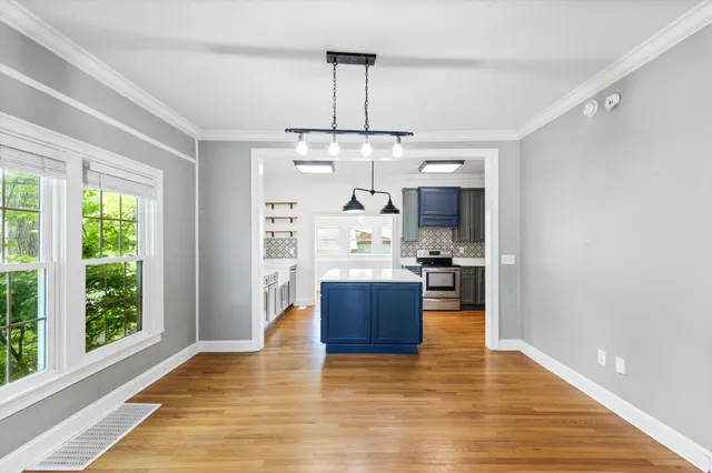 a spacious bathroom with a sink vanity and a mirror