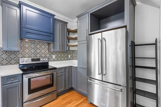 a kitchen with a sink and appliances