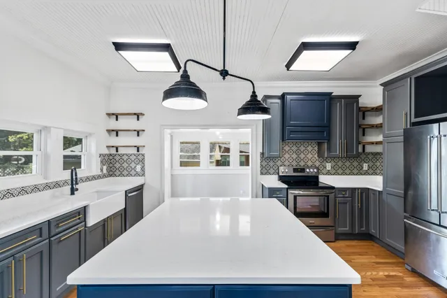 a view of an entryway with wooden floor