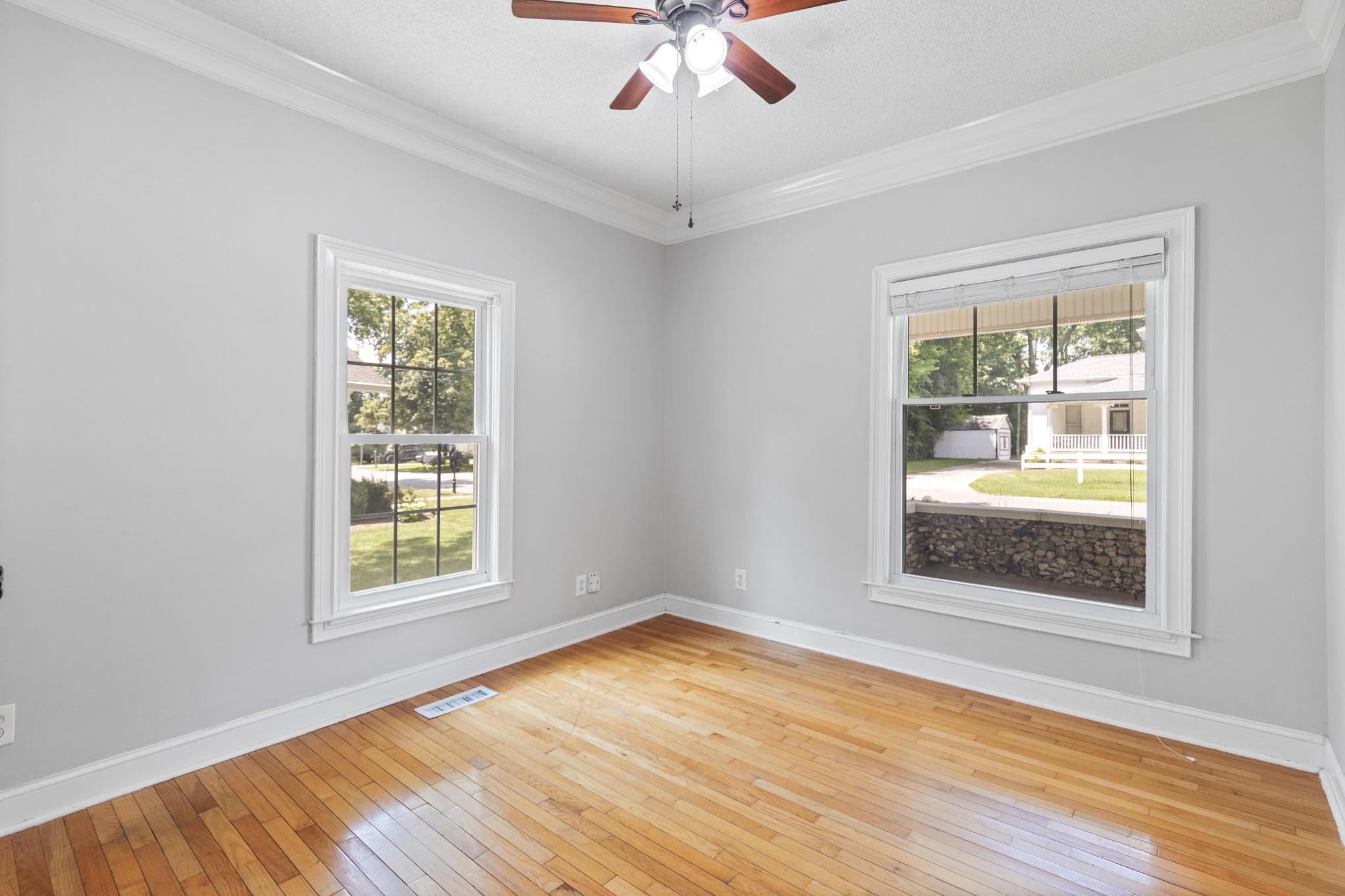 253 15th Street Northwest Cleveland, TN 37311 - Photo 20 of 35 an empty room with wooden floor chandelier and windows