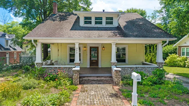 a front view of a house with garden