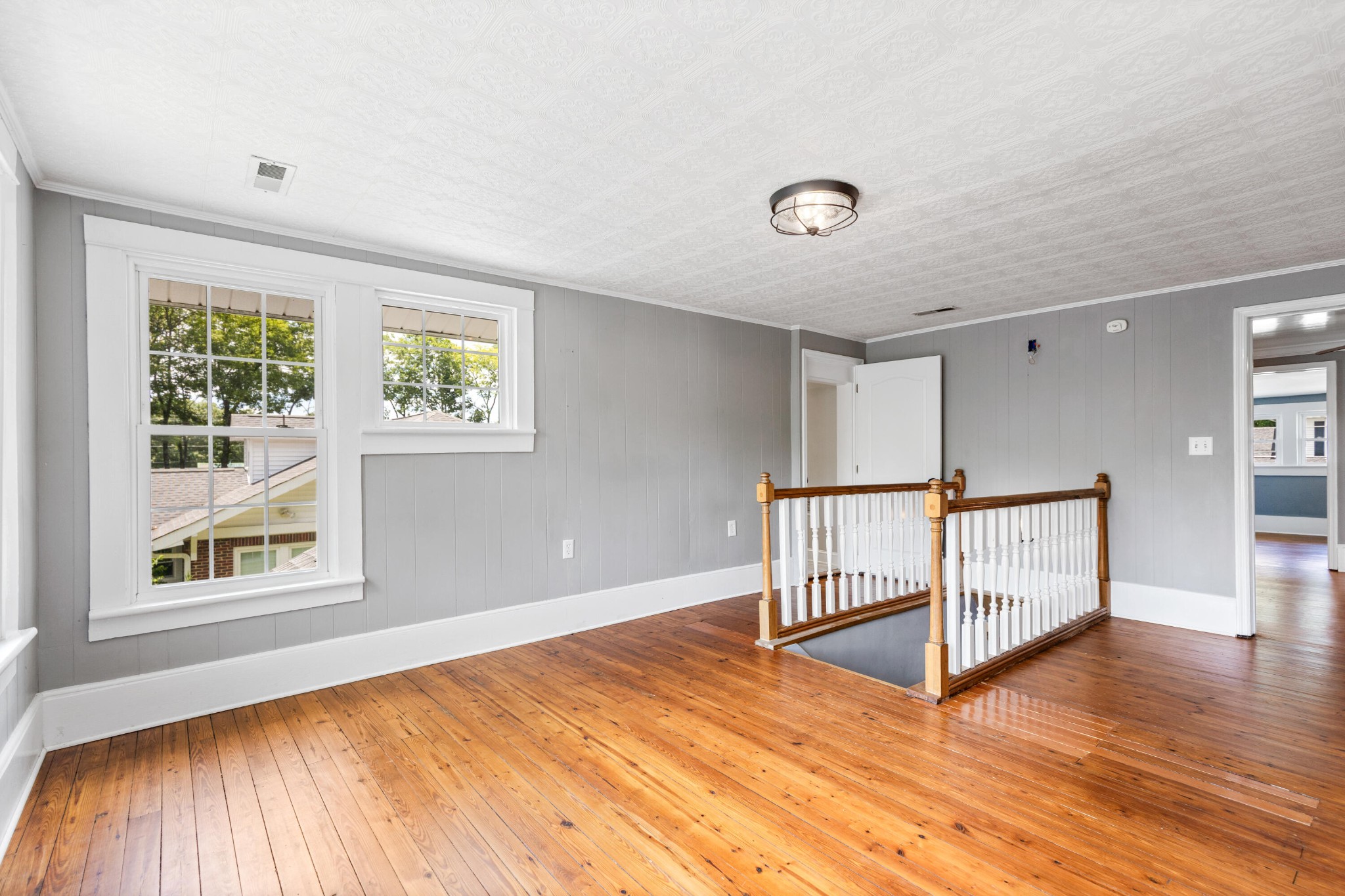 253 15th Street Northwest Cleveland, TN 37311 - Photo 26 of 35 an empty room with wooden floor and windows