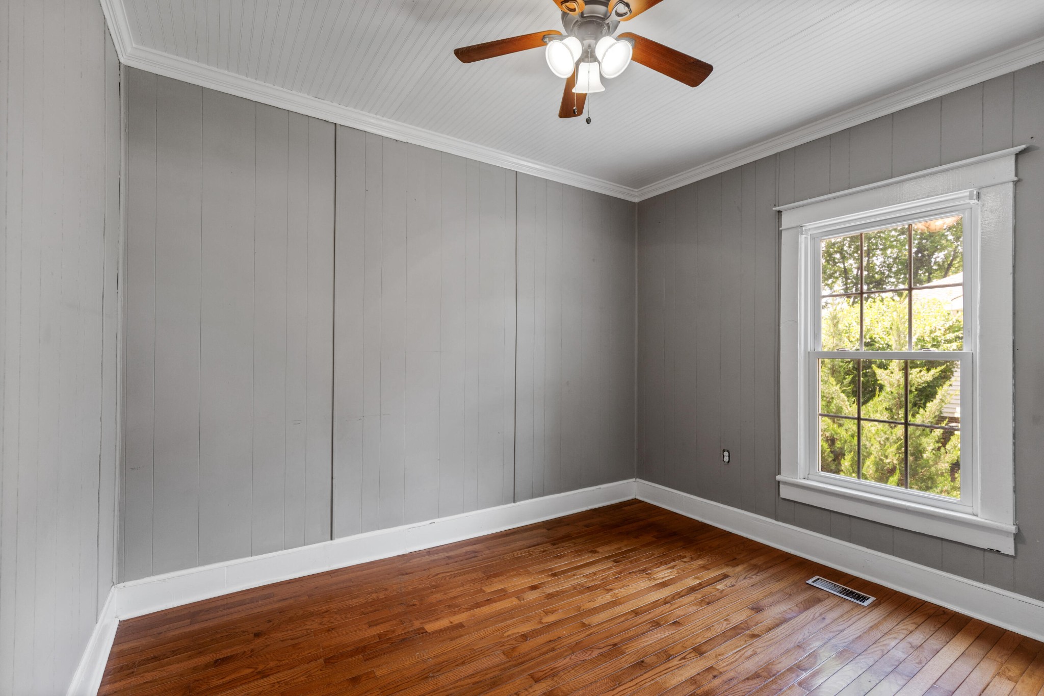253 15th Street Northwest Cleveland, TN 37311 - Photo 32 of 35 an empty room with a window and wooden floor