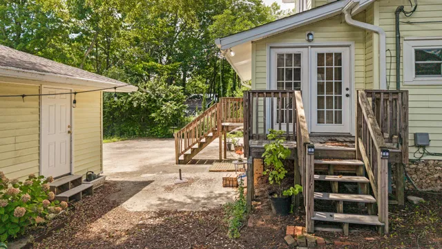 a view of a house with backyard and sitting area