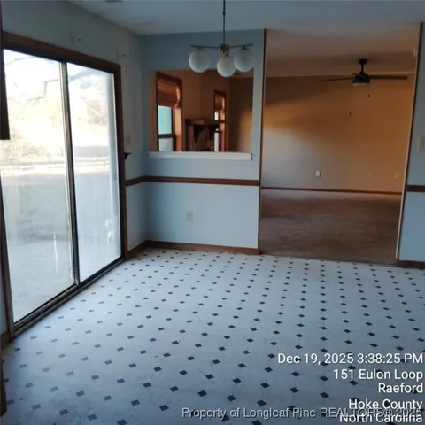 a view of a hallway with a window