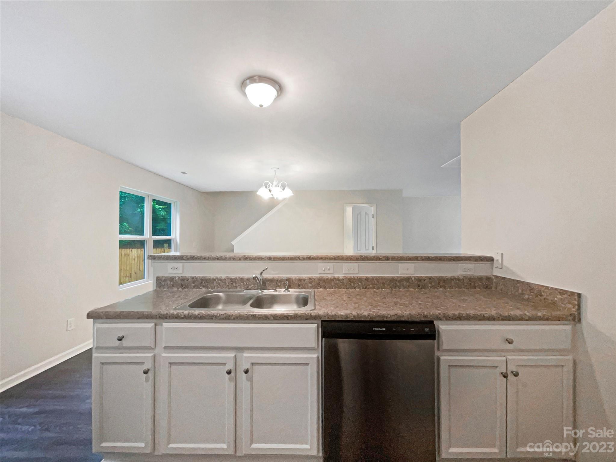 320 Peachtree Road Charlotte, NC 28216 - Photo 13 of 18 a sink with cabinets and window