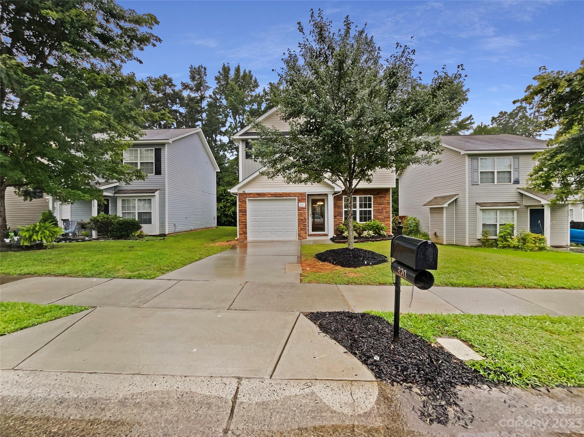 320 Peachtree Road Charlotte, NC 28216 - Photo 7 of 18 a view of a house with a backyard