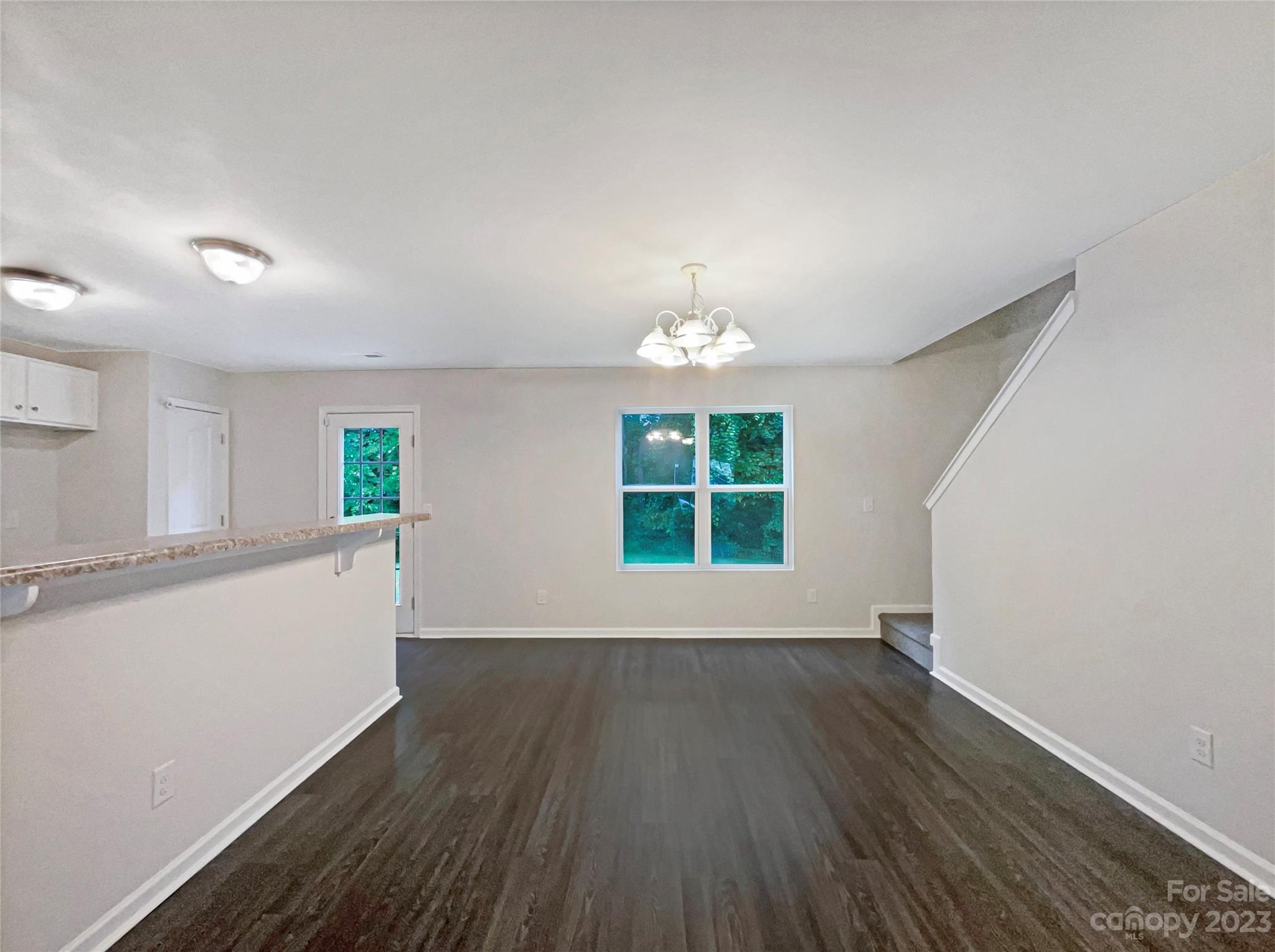 320 Peachtree Road Charlotte, NC 28216 - Photo 9 of 18 wooden floor in an empty room with a window