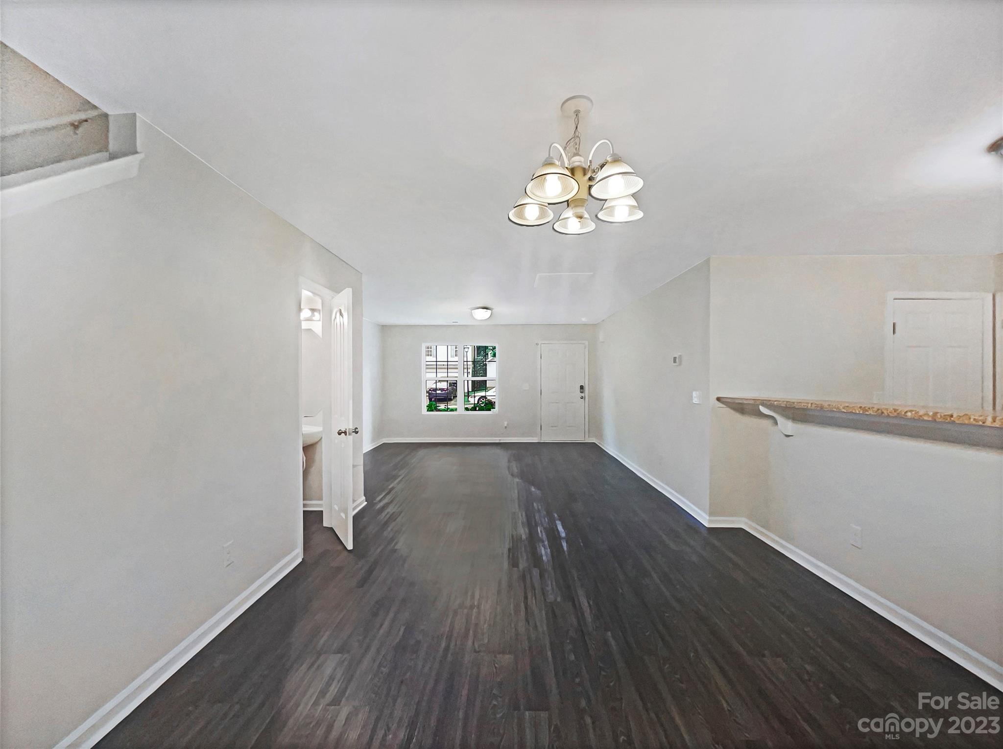 320 Peachtree Road Charlotte, NC 28216 - Photo 10 of 18 a view of empty room with wooden floor and window