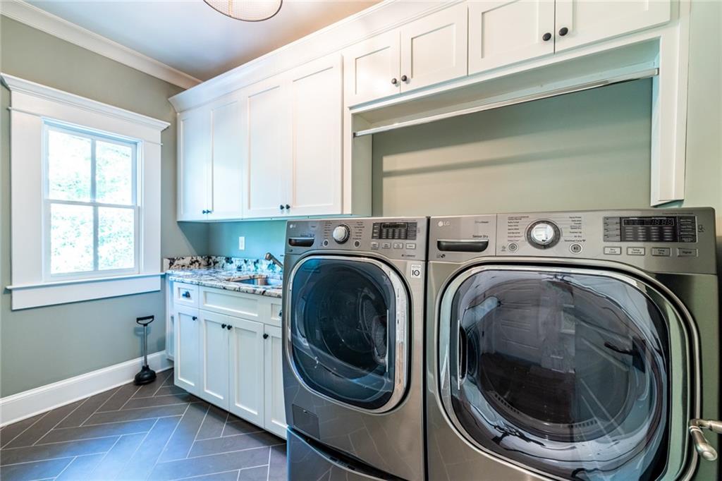 538 Ansley Street Decatur, GA 30030 - Photo 50 of 73 a utility room with dryer and washer
