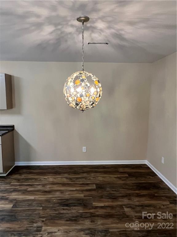 330 Holiday Road Lancaster, SC 29720 - Photo 8 of 12 a view of a room with wooden floor and a ceiling fan