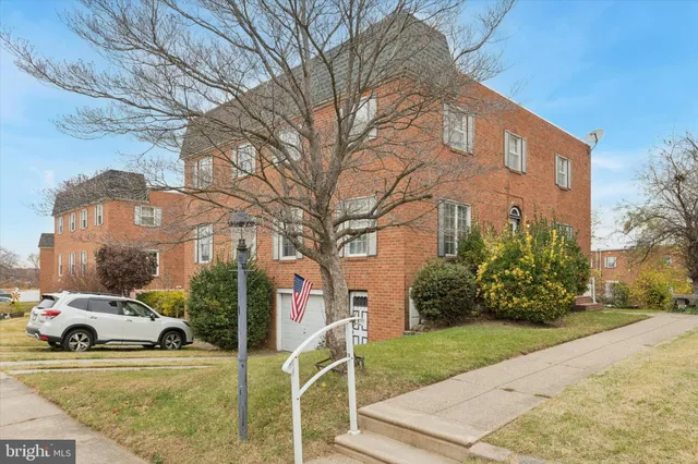 a view of a parked cars in front of a house