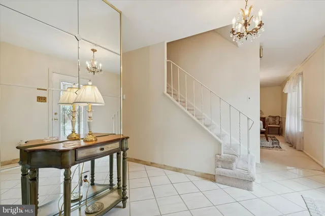 a view of a dining room with a table and chairs