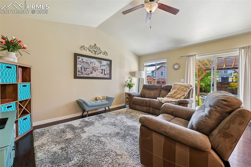 10214 Prairie Ridge Court Peyton, CO 80831 - Photo 12 of 42 a living room with furniture and a flat screen tv