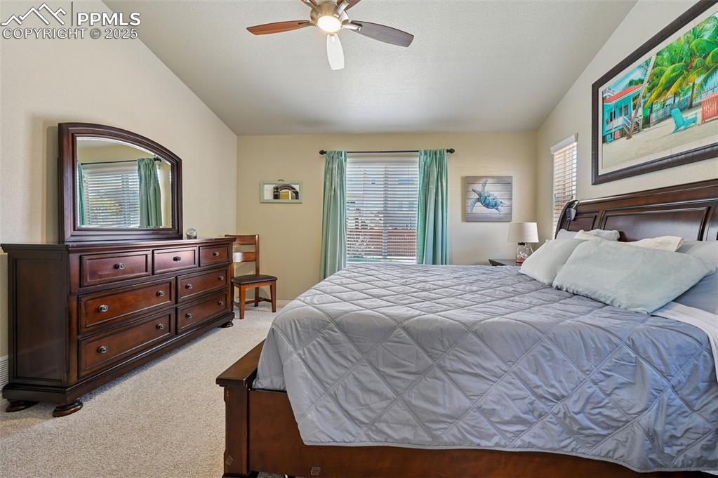 10214 Prairie Ridge Court Peyton, CO 80831 - Photo 19 of 42 a bedroom with a bed and a dresser