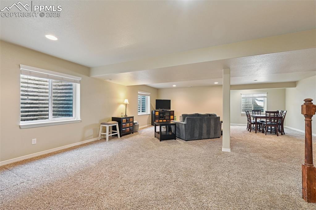 10214 Prairie Ridge Court Peyton, CO 80831 - Photo 25 of 42 a living room with furniture and a window