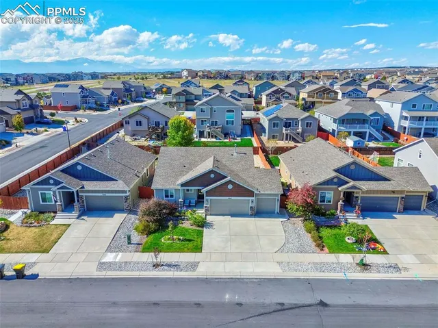 a view of houses with an outdoor space and lakeside