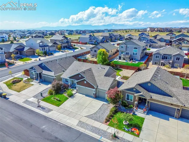 an aerial view of a house with a garden