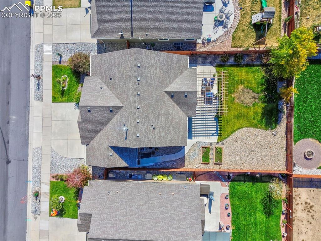 10214 Prairie Ridge Court Peyton, CO 80831 - Photo 39 of 42 a aerial view of a house with a yard and potted plants