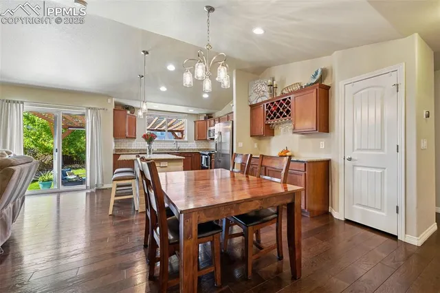 a view of a dining area with furniture and wooden floor