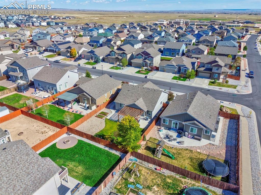 10214 Prairie Ridge Court Peyton, CO 80831 - Photo 42 of 42 an aerial view of a house with a swimming pool yard and outdoor seating