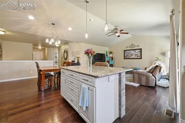 a view of living room with granite countertop furniture and fireplace