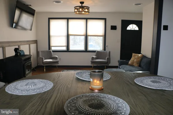 a kitchen with furniture and a fireplace