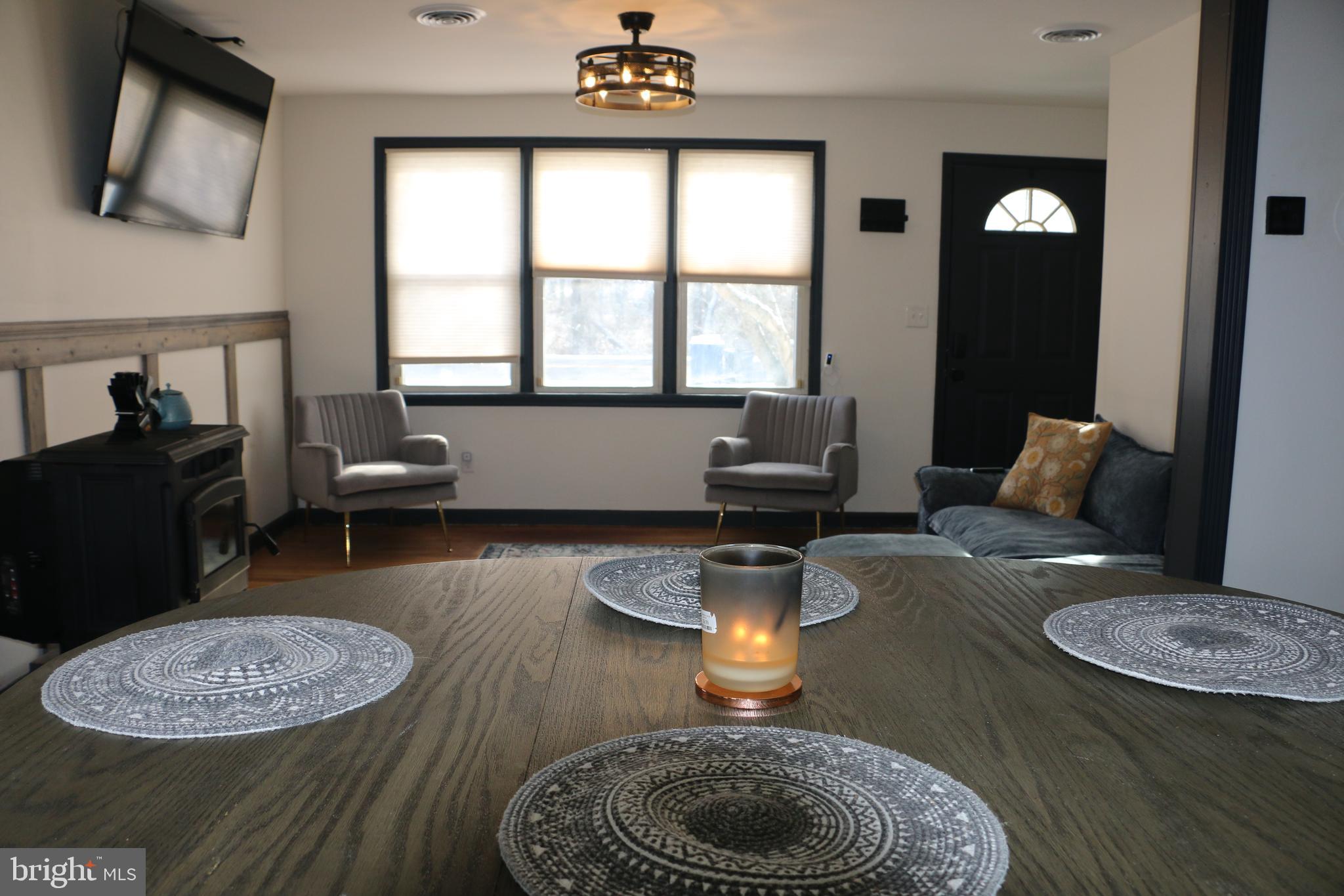 2717 Monmouth Road Jobstown, NJ 08041 - Photo 2 of 9 a kitchen with furniture and a fireplace