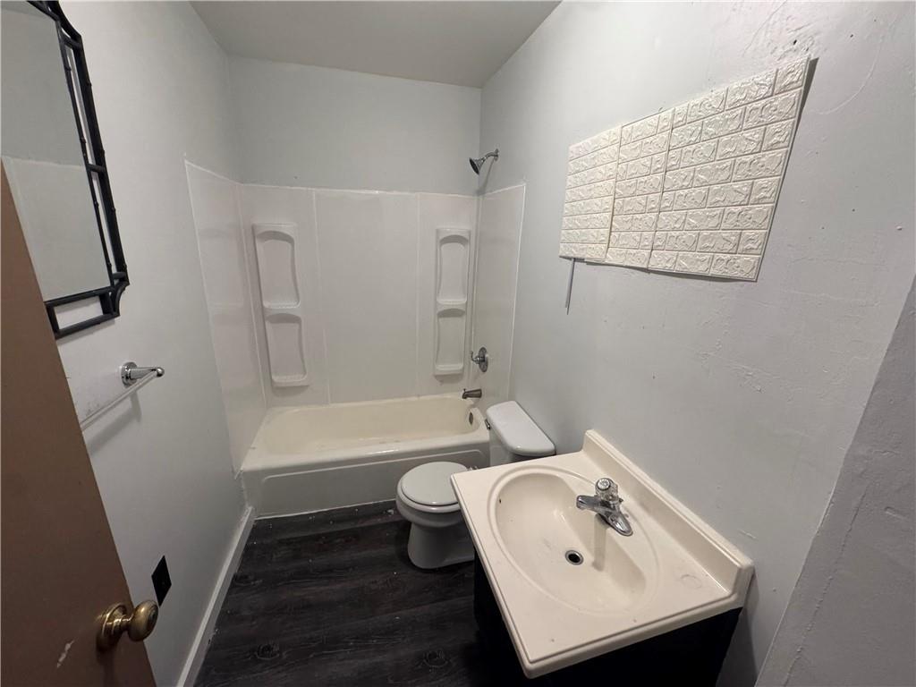 713 Freeport Road, Unit B Creighton, PA 15030 - Photo 11 of 11 a bathroom with a sink a toilet and shower