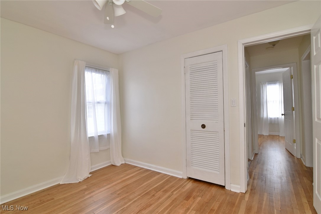 1575 Lander Road Cleveland, OH 44124 - Photo 26 of 49 Unfurnished bedroom featuring light wood finished floors, a ceiling fan, and a closet