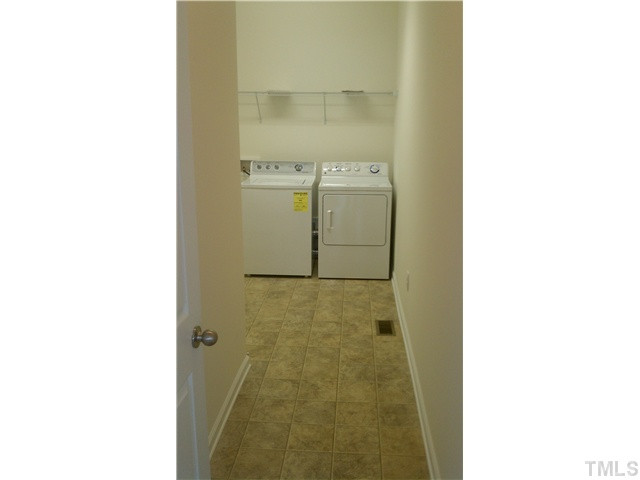 1507 Pattersons Mill Road Durham, NC 27703 - Photo 8 of 25 Large mud room/laudry room on the first floor with washer and dryer!