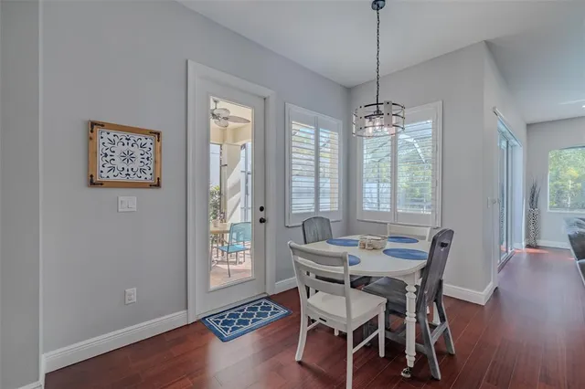 a bedroom with a large bed and a flat tv screen on dresser