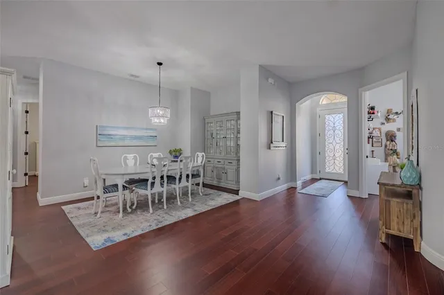 an aerial view of a house with a garden and swimming pool
