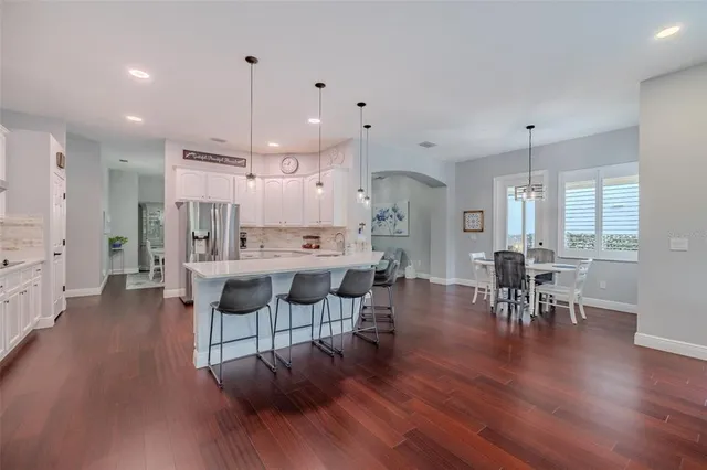 a view of a dining room with furniture and wooden floor