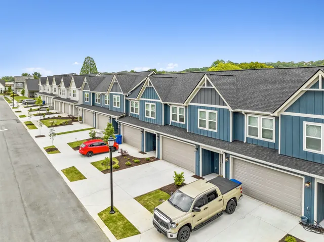 a aerial view of a house with swimming pool and sitting area