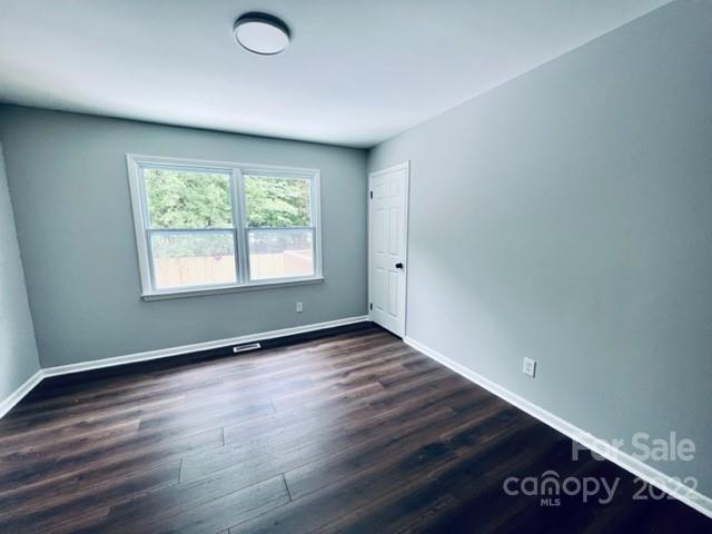 3419 Lake Shore Road South Denver, NC 28037 - Photo 10 of 20 an empty room with wooden floor and windows