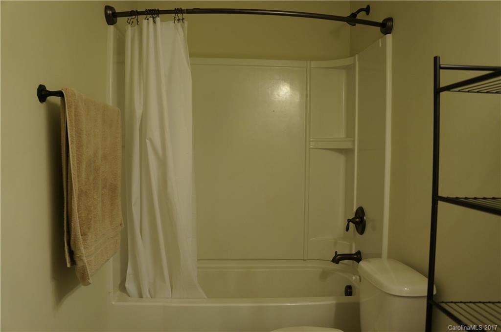 9027 Paddle Oak Road Charlotte, NC 28227 - Photo 11 of 22 a bathroom with a shower and a tub
