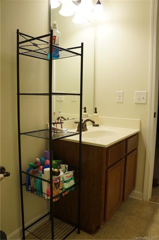 9027 Paddle Oak Road Charlotte, NC 28227 - Photo 12 of 22 a bathroom with a sink and mirror